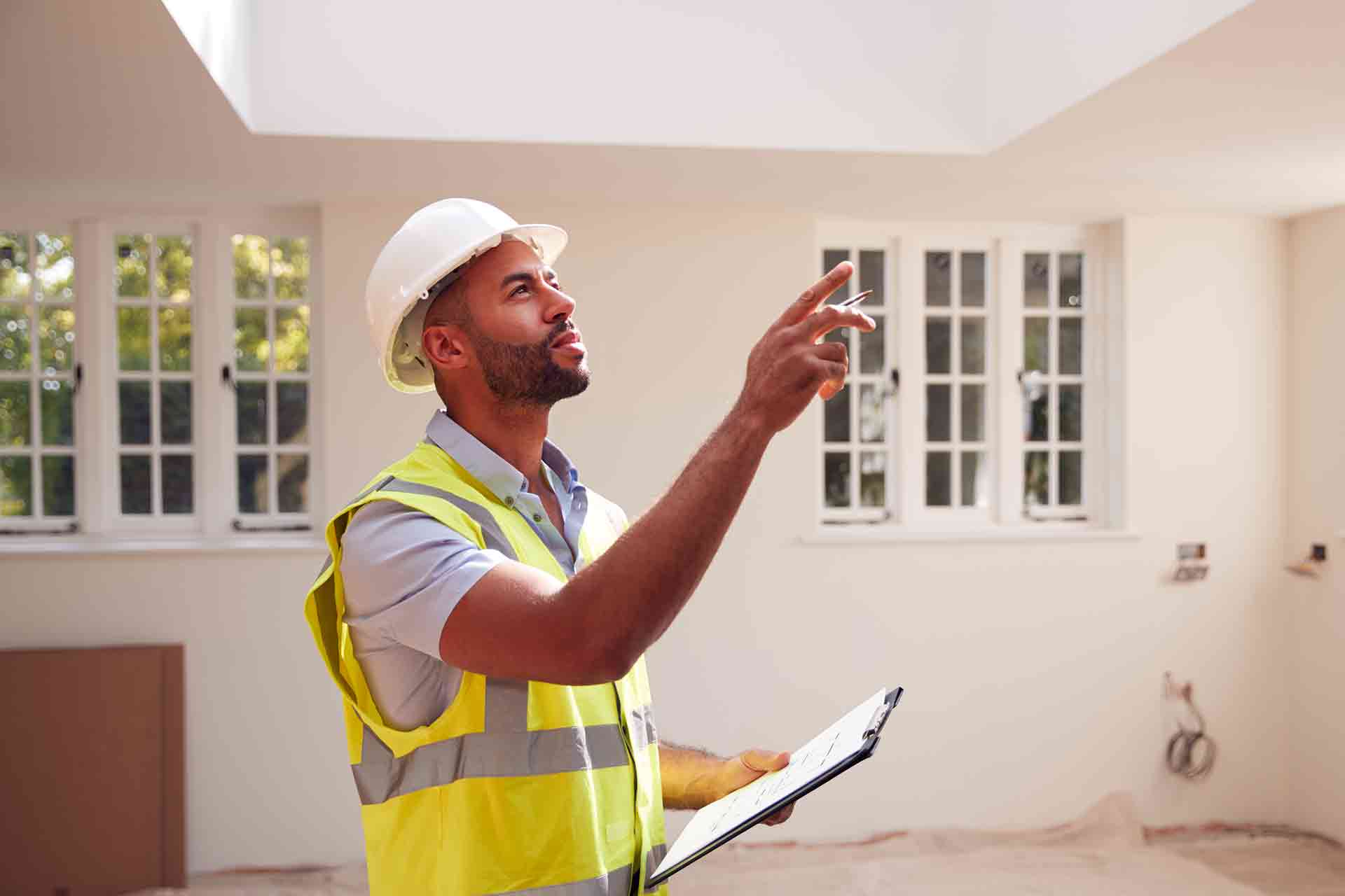 Third Party Wall Surveyors Banbury reviewing plans between two parties during a dispute